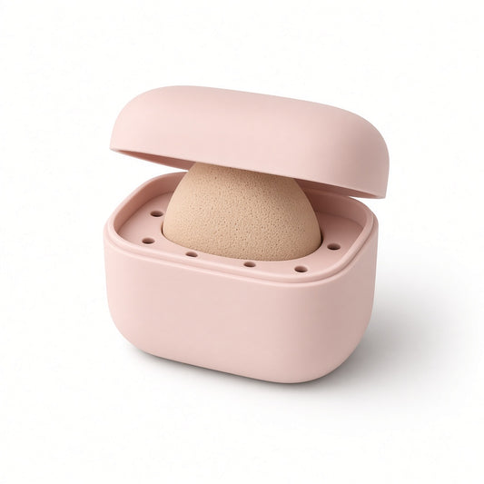 Blush silicone makeup sponge case, open, with a sponge inside